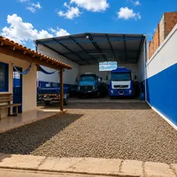 Galpao com caminhoes estacionados da WSJ Transporte e Locacoes no bairro Trevisa em Campo Grande/MS!