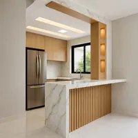 Cozinha integrada com bancada e balcão em mármore da Decorativa Mármores e Granitos no Jardim Jockey Club em Cui